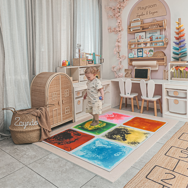 Sensory and colorful floor tiles to encourage motor skills, color recognition, and imaginative play