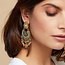 Gas Bijoux Chana turquoise gold. Orecchini in metallo dorato composti da delicati pezzi di filigrana, ornati da perline turchesi e nappe dorate.