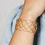 armband - woven bangle - verguld