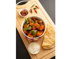 Surinaamse kip kerrie met aardappelen