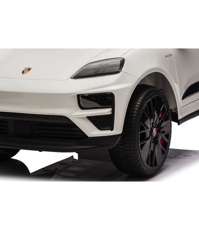 Porsche Macan Turbo, coche eléctrico para niños con batería de litio, módulo de música, neumáticos de goma y mucho más.