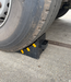 TRUCKSTOP Rubber wheel chock for trucks and large vehicles with yellow reflective strips