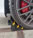 TRUCKSTOP Rubber wheel chock for trucks and large vehicles with yellow reflective strips