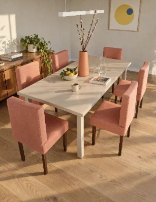 Table and chairs on bare floor