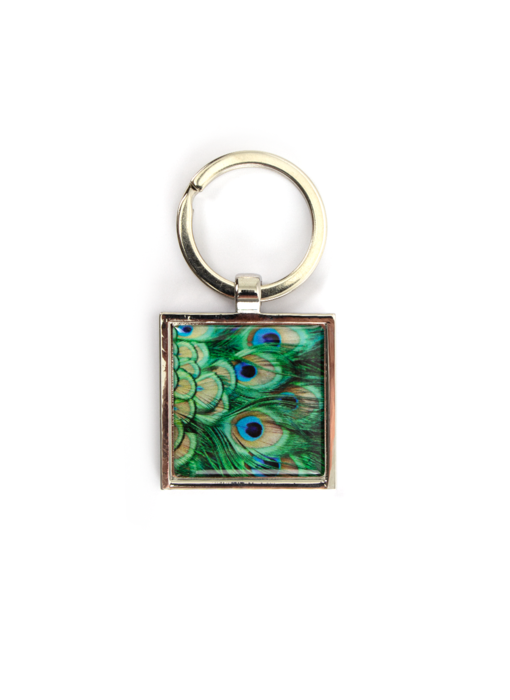 Llavero de metal dorado, plumas de pavo real