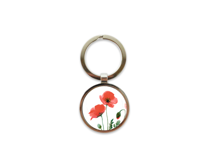 Llavero de metal color plata, amapolas