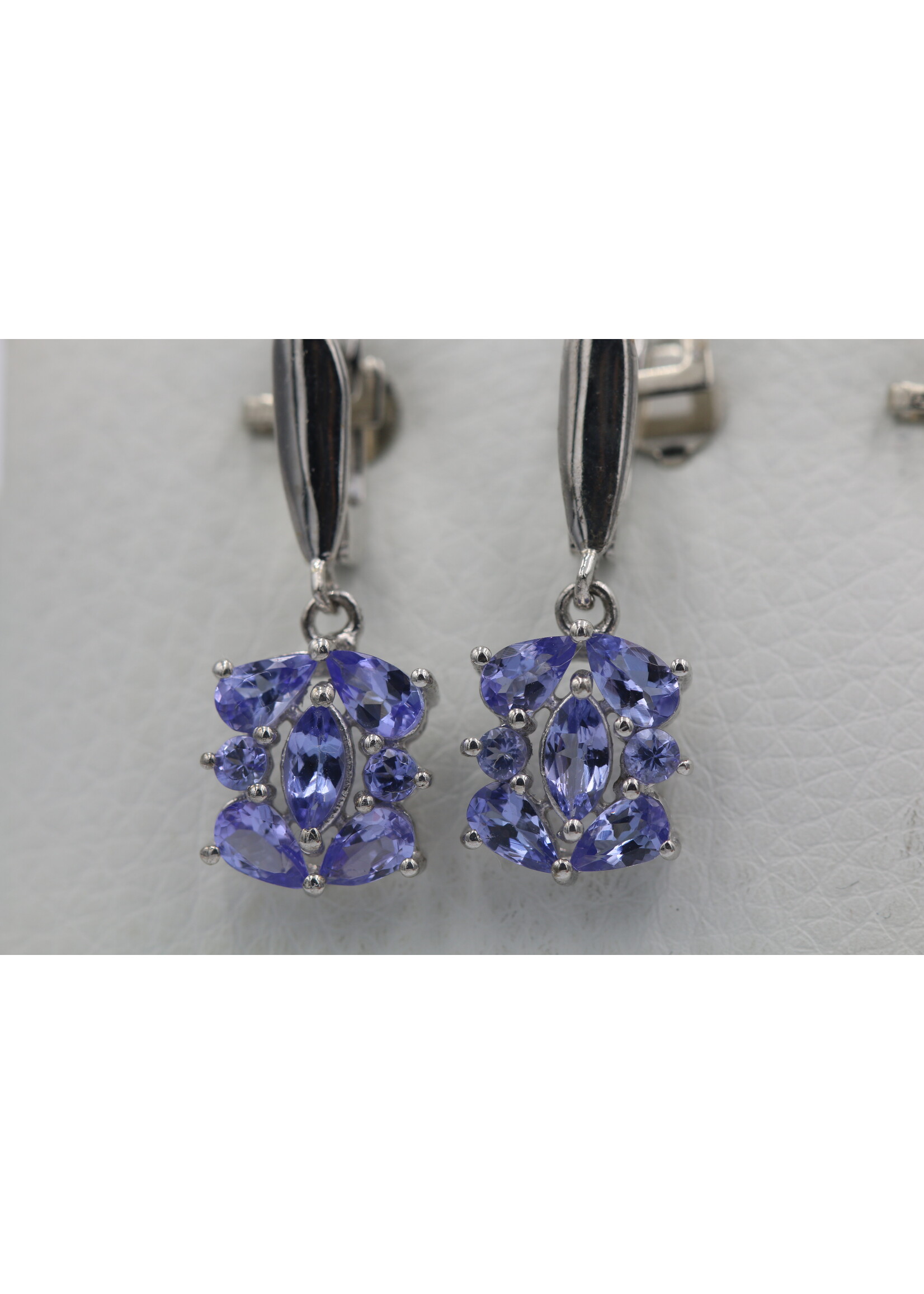 925 rhodium plated silver earrings set with natural tanzanites