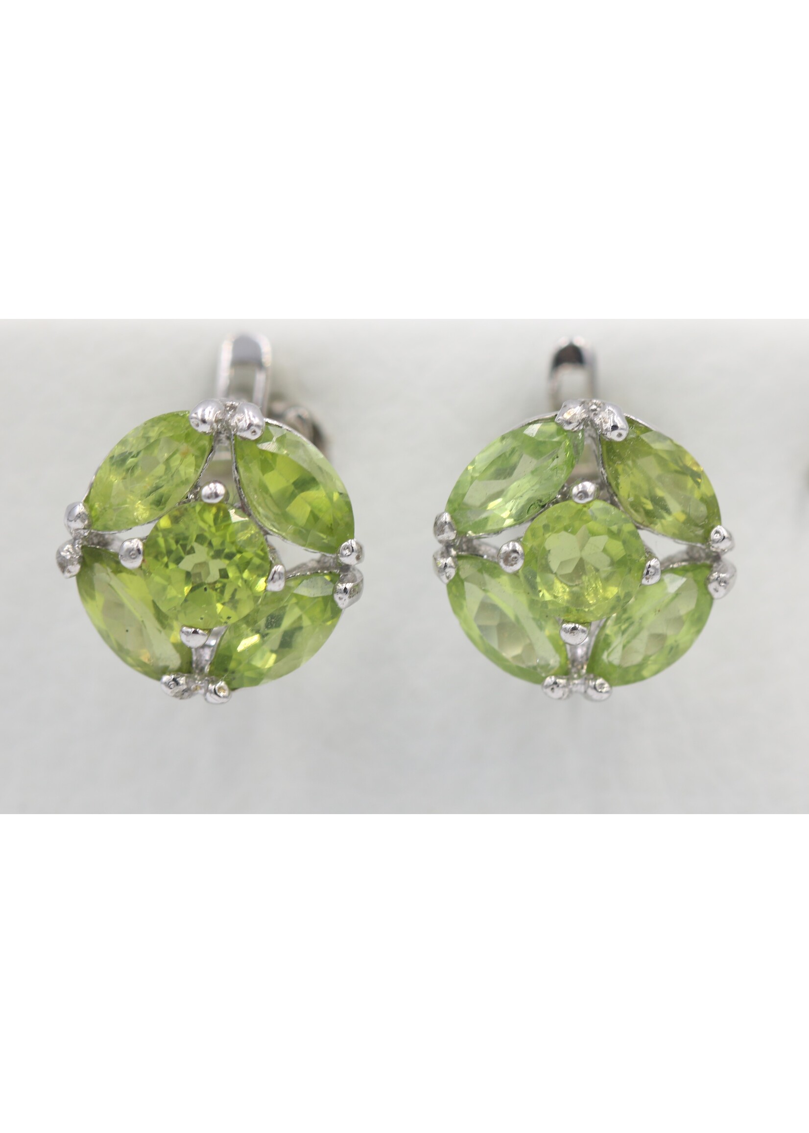 925 rhodium plated silver earrings set with natural peridots