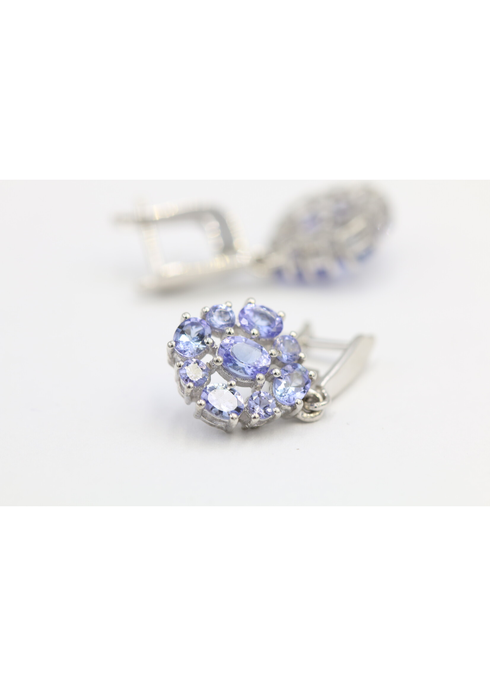 925 rhodium plated silver earrings set with natural tanzanites