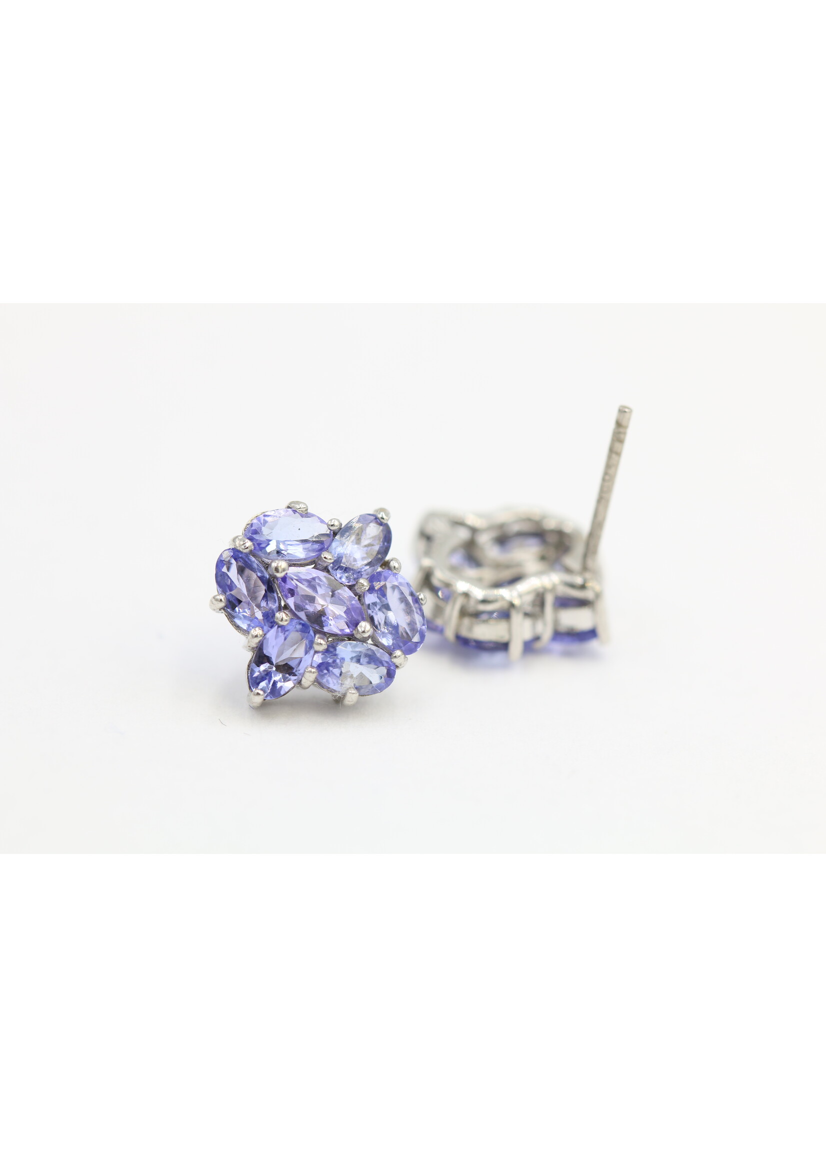 925 rhodium plated silver earrings set with natural tanzanites