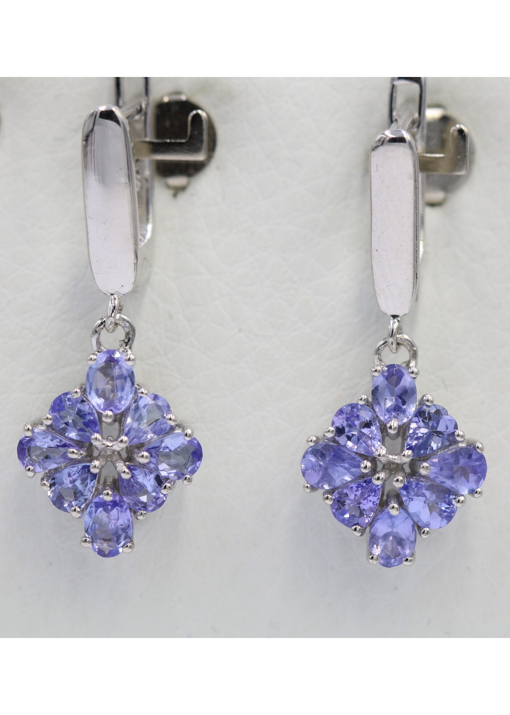 925 rhodium plated silver earrings set with natural tanzanites