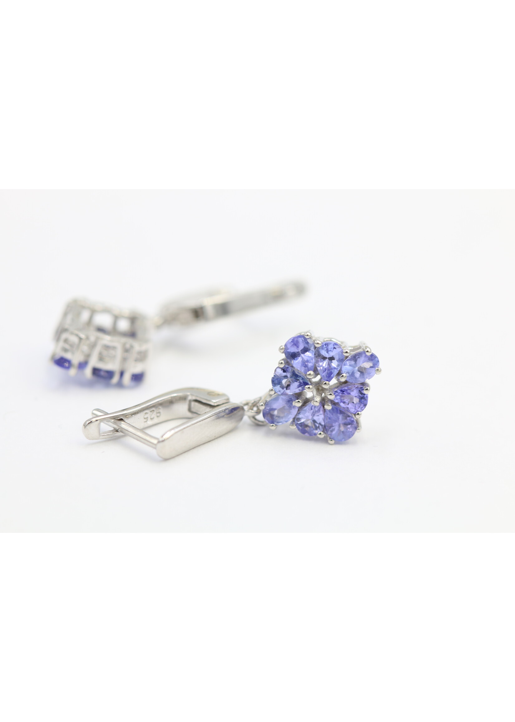925 rhodium plated silver earrings set with natural tanzanites