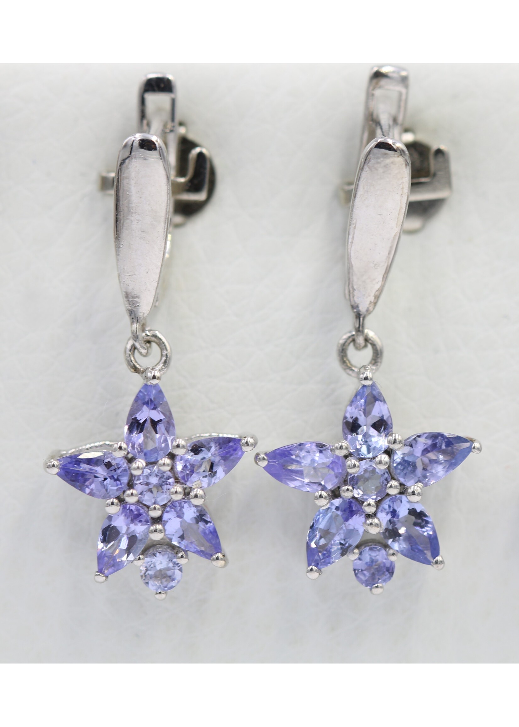 925 rhodium plated silver earrings set with natural tanzanites