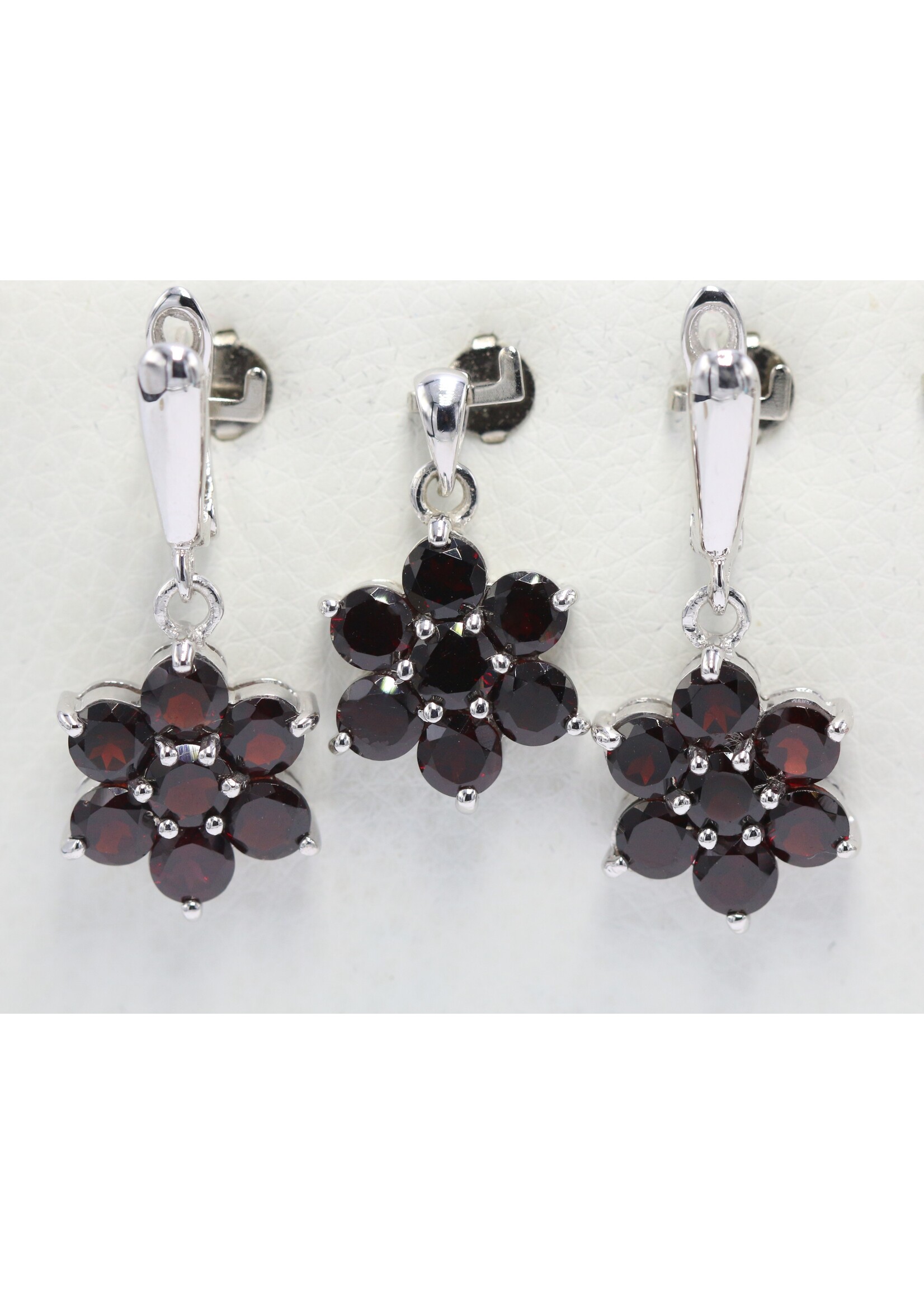 925 rhodium plated silver set with natural garnets