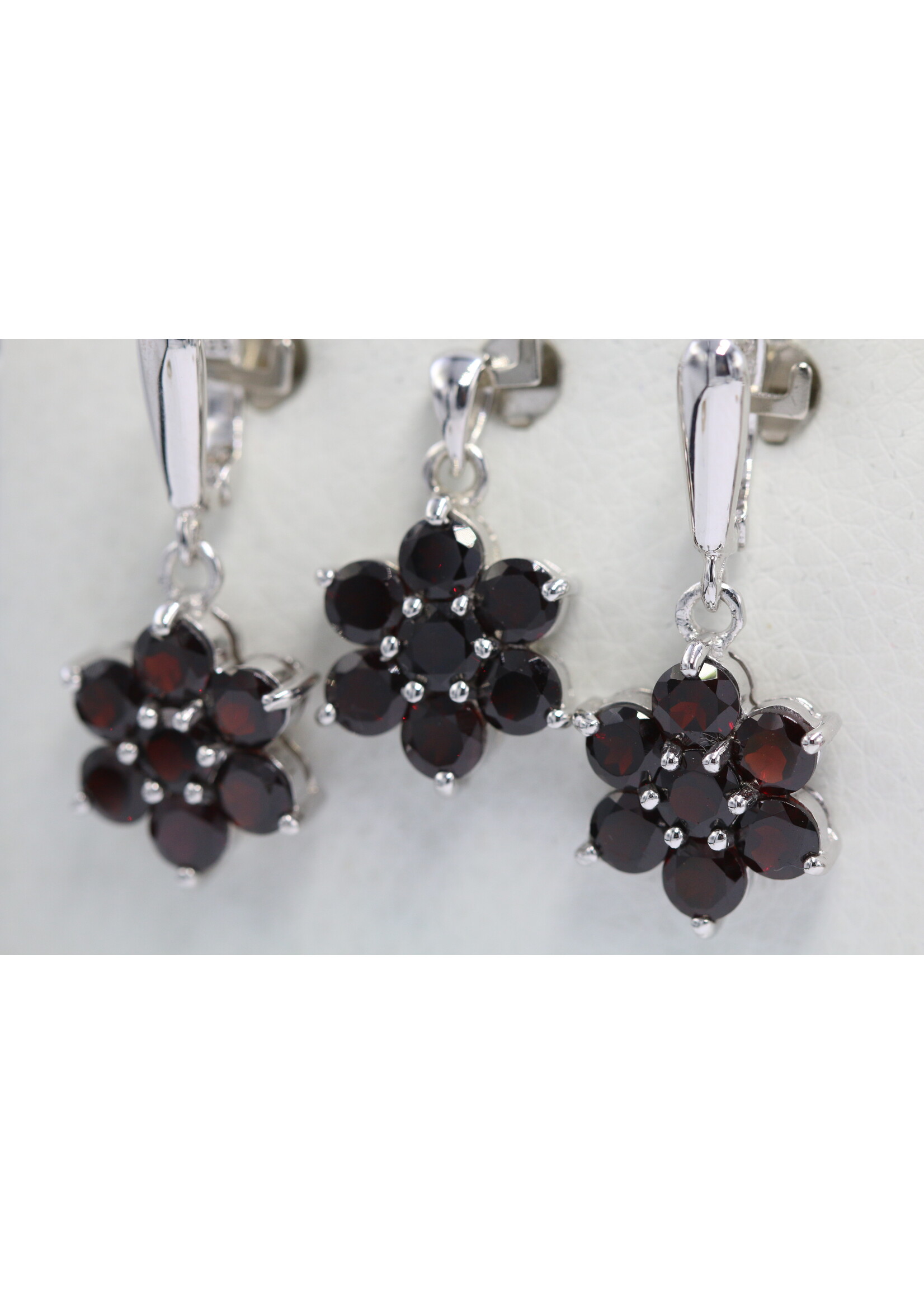 925 rhodium plated silver set with natural garnets
