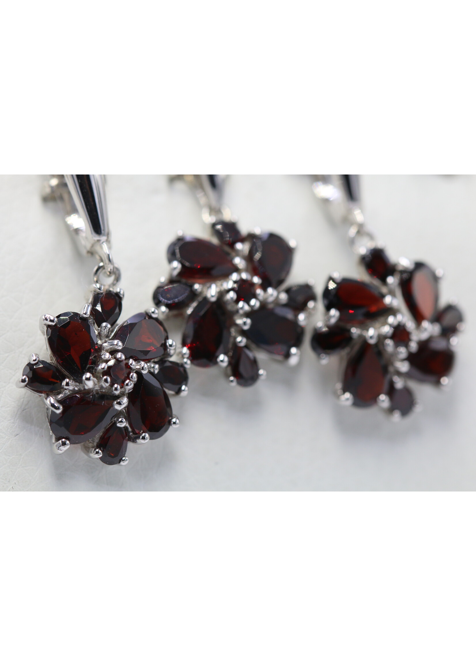 925 rhodium plated silver set with natural garnets