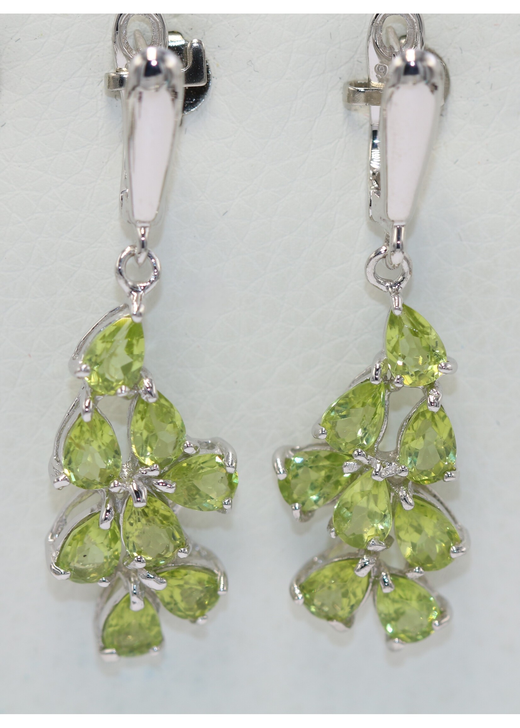 925 rhodium plated silver earrings set with natural peridots