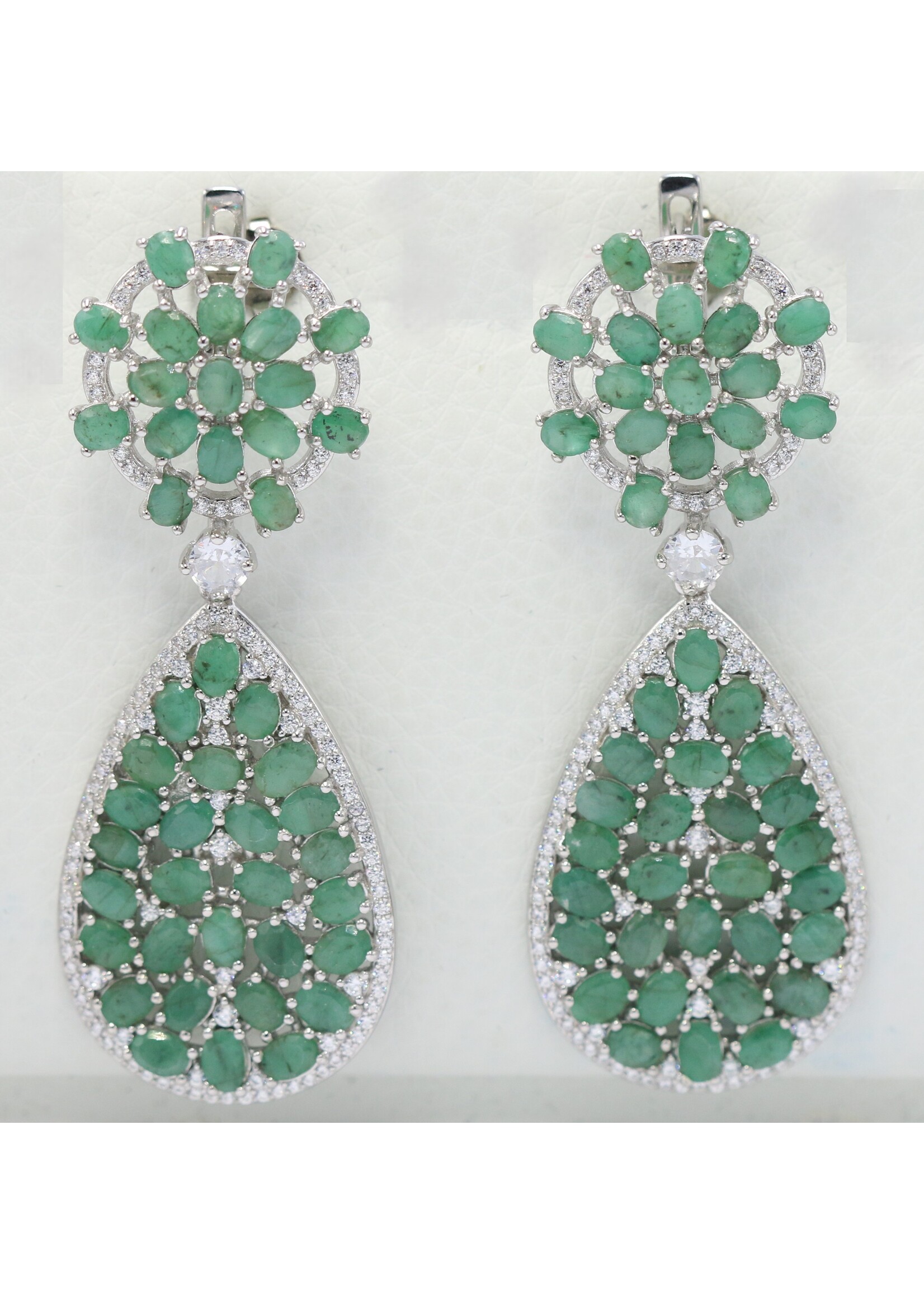 925 rhodium plated silver earrings set with natural emeralds