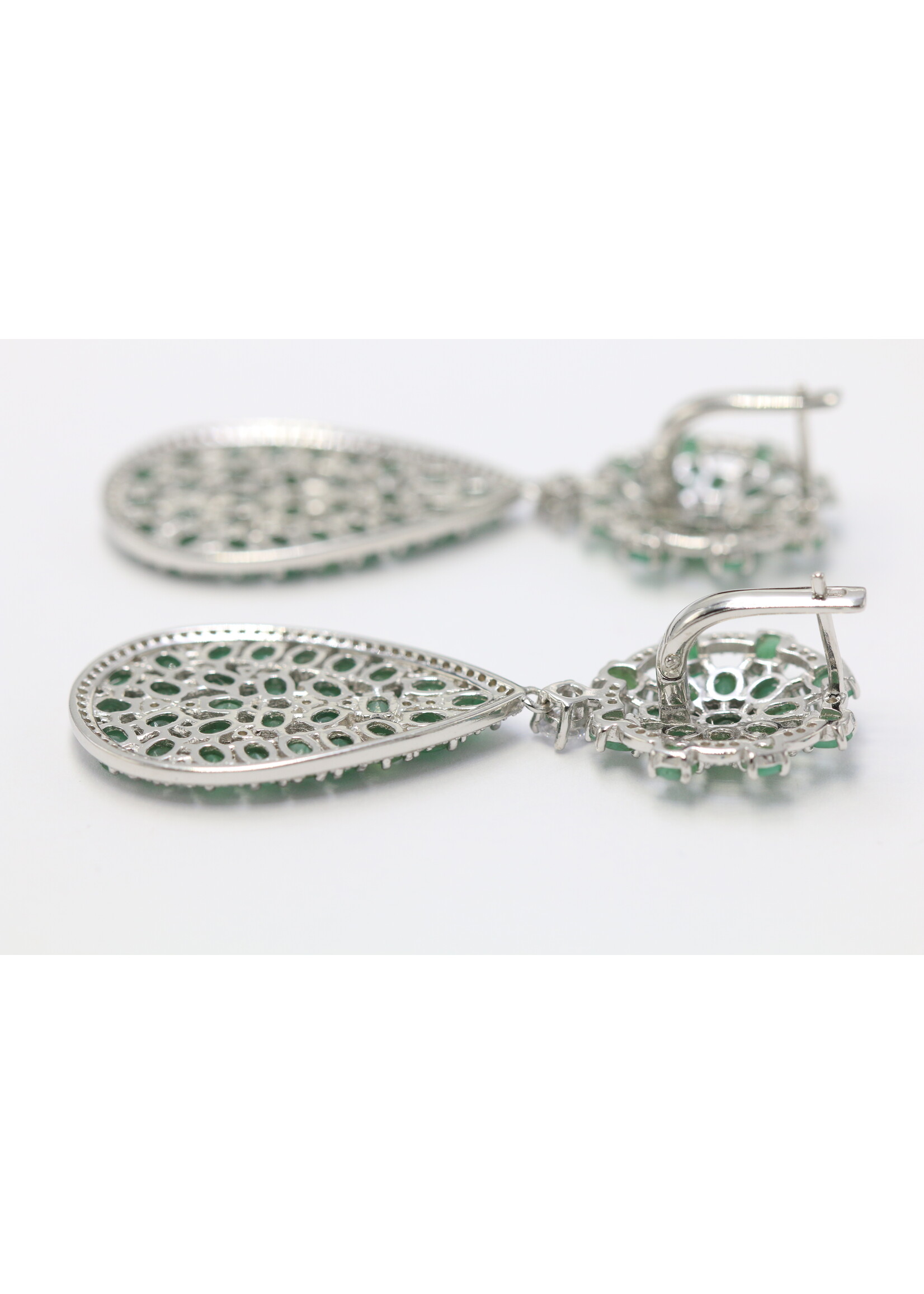 925 rhodium plated silver earrings set with natural emeralds