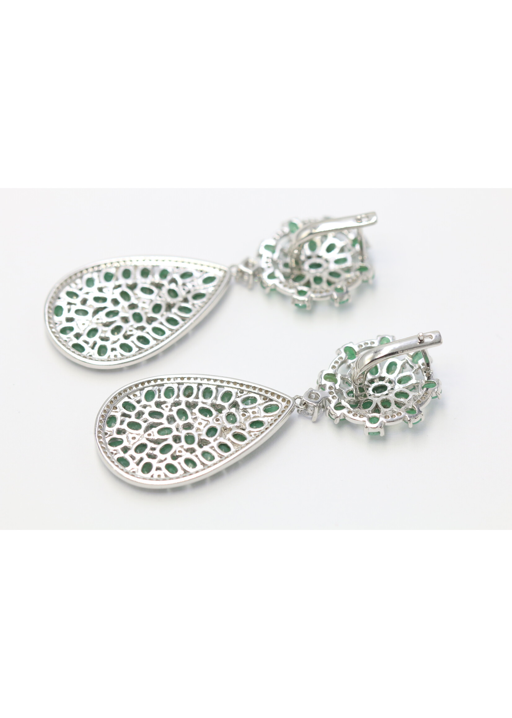 925 rhodium plated silver earrings set with natural emeralds