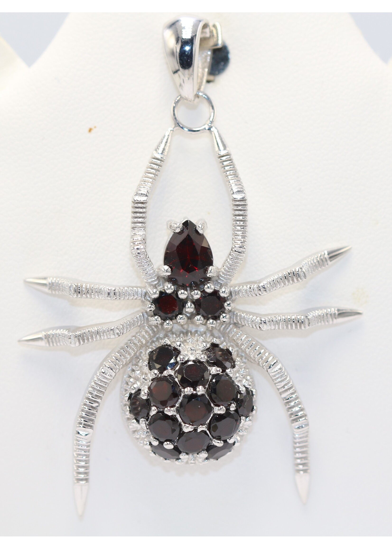 925 rhodium plated silver pendant set with natural garnets