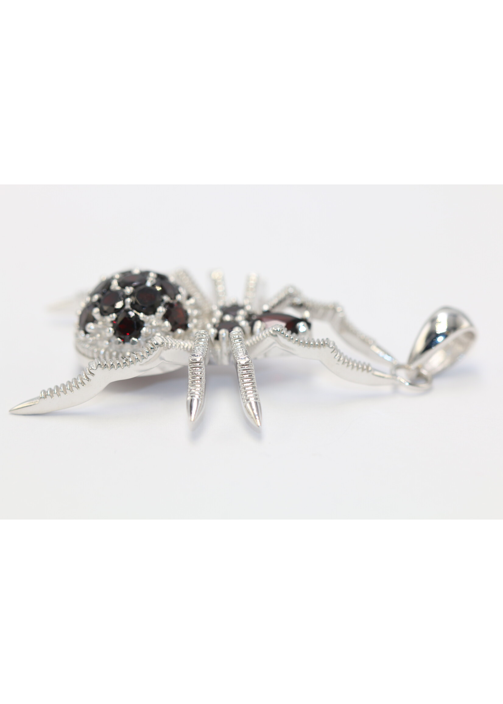 925 rhodium plated silver pendant set with natural garnets