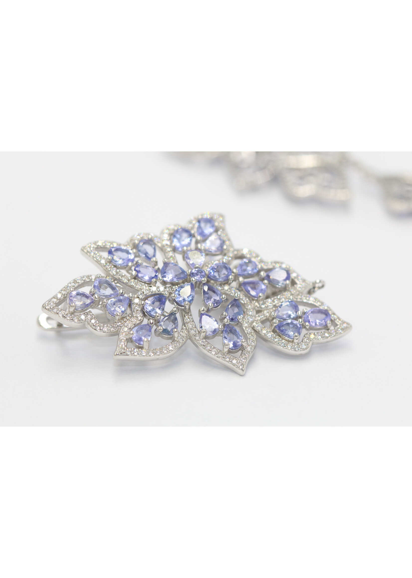 925 rhodium plated silver earrings set with natural tanzanites