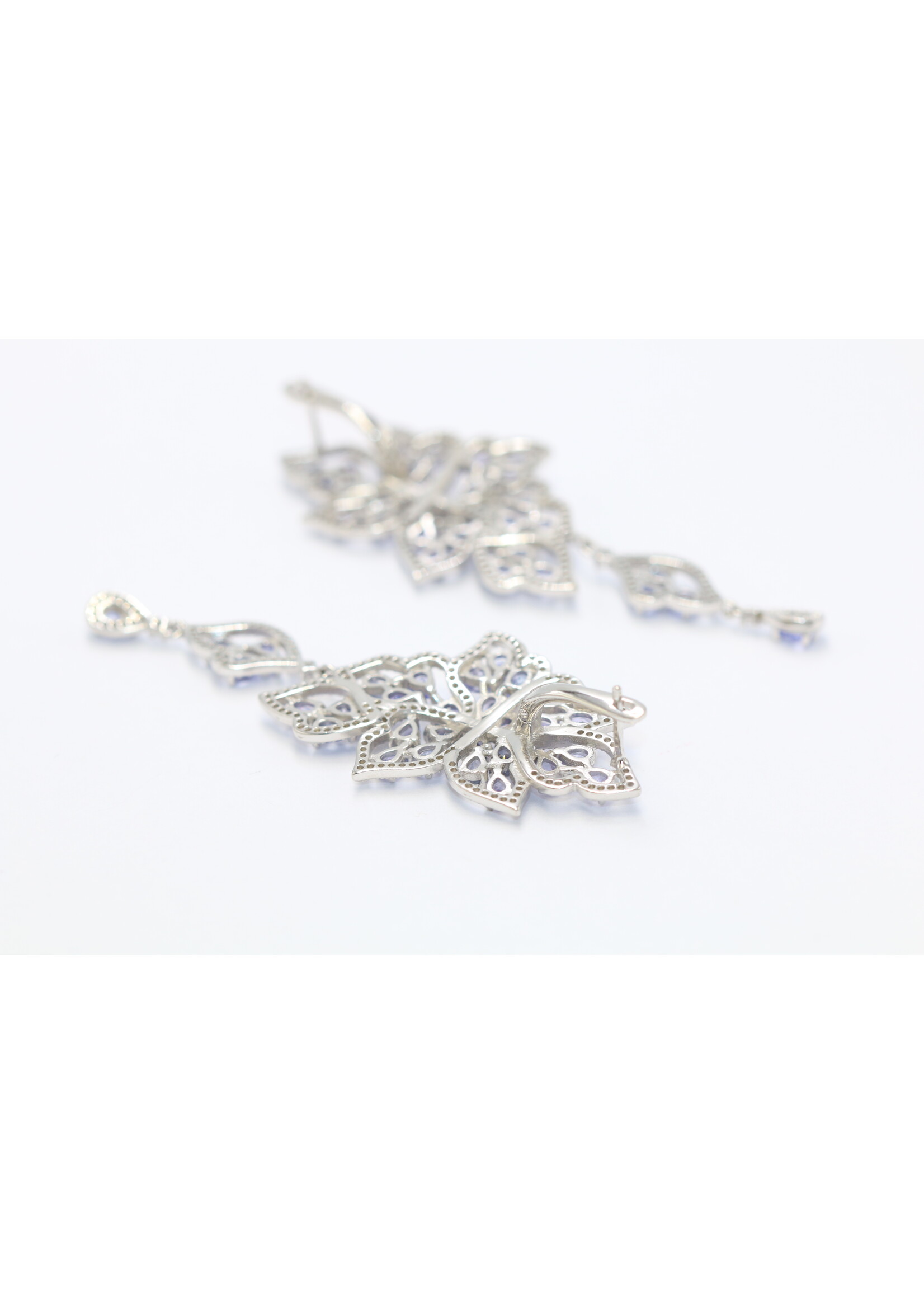 925 rhodium plated silver earrings set with natural tanzanites