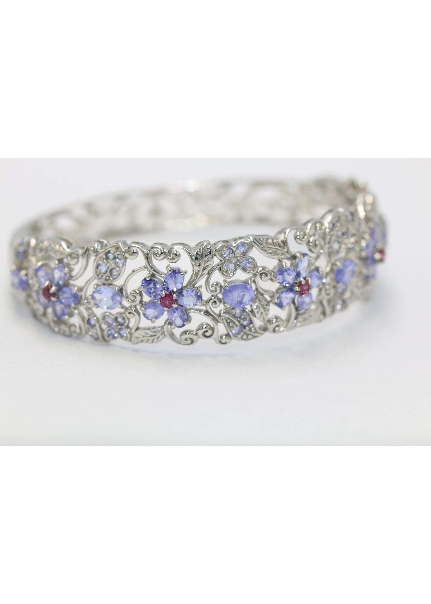 925 rhodium plated silver bracelet set with natural Tanzanites and Rhodolites