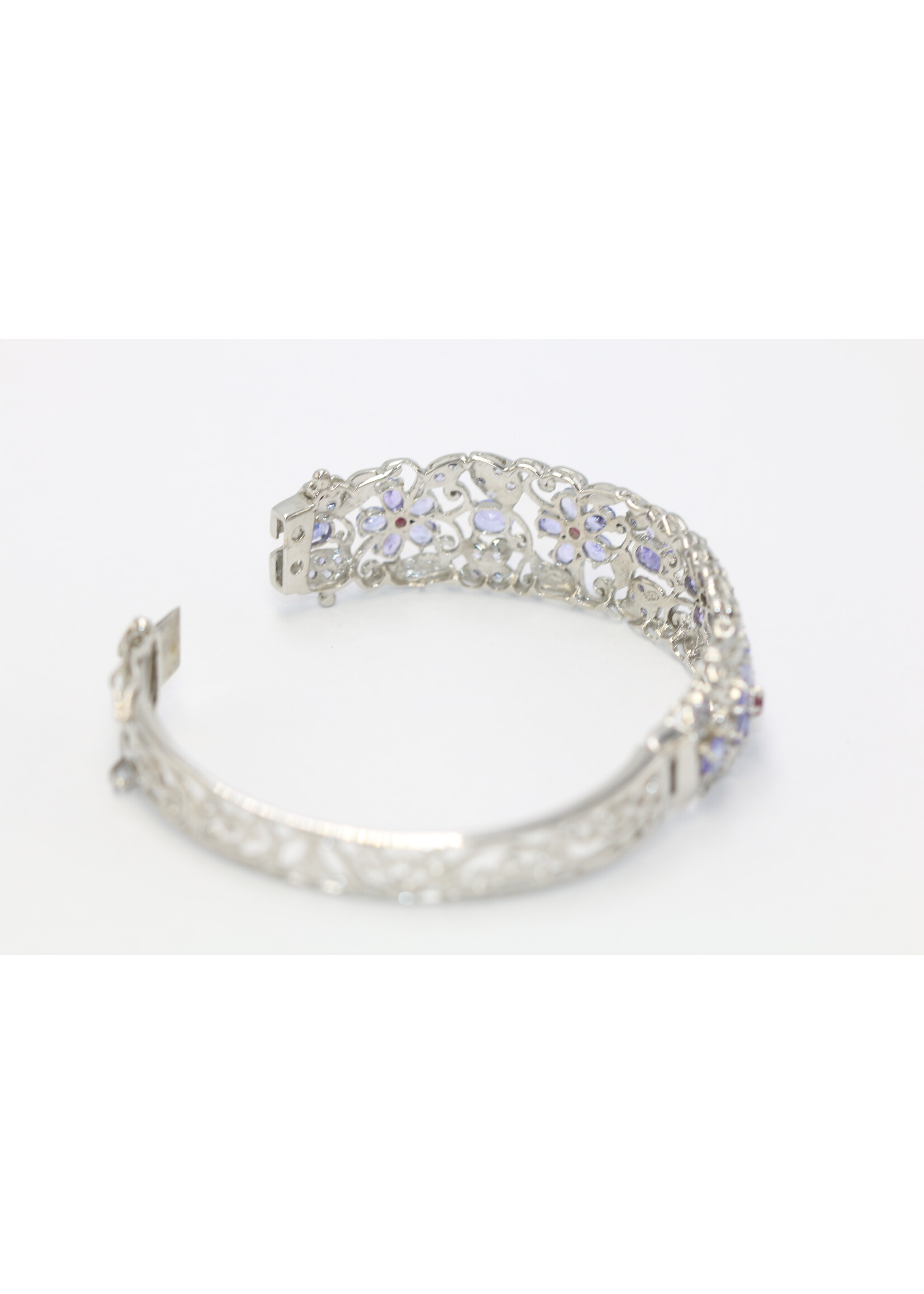 925 rhodium plated silver bracelet set with natural Tanzanites and Rhodolites