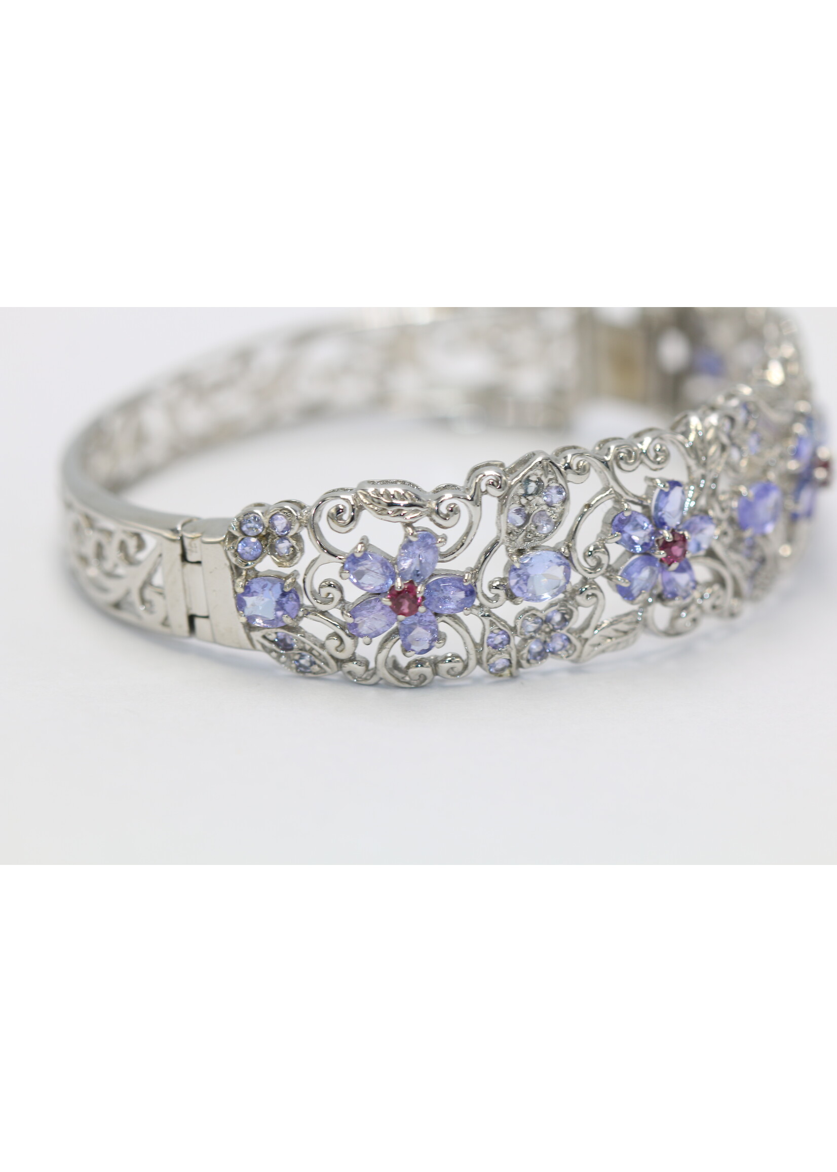 925 rhodium plated silver bracelet set with natural Tanzanites and Rhodolites
