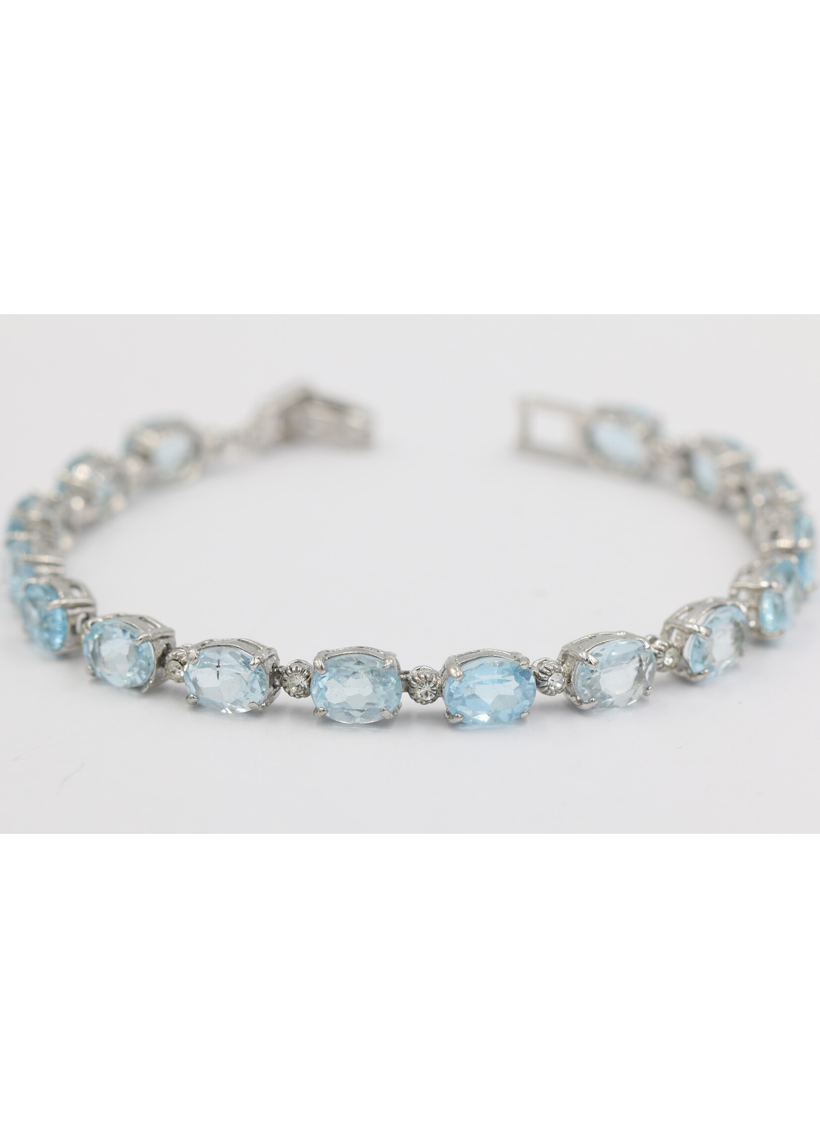 925 rhodium plated silver bracelet set with natural Blue Topaz