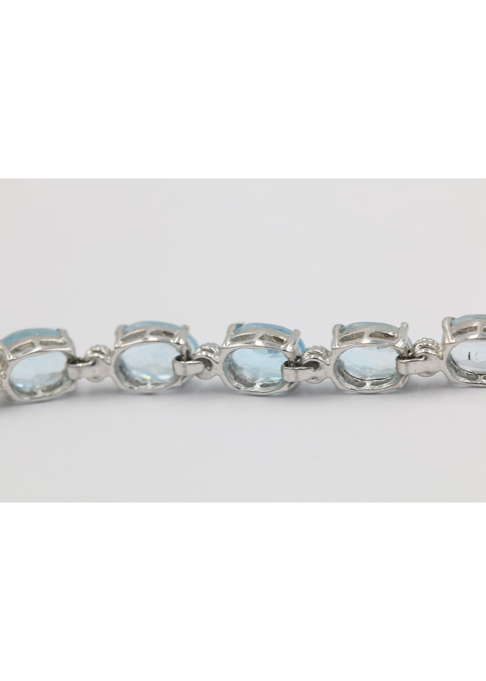 925 rhodium plated silver bracelet set with natural Blue Topaz