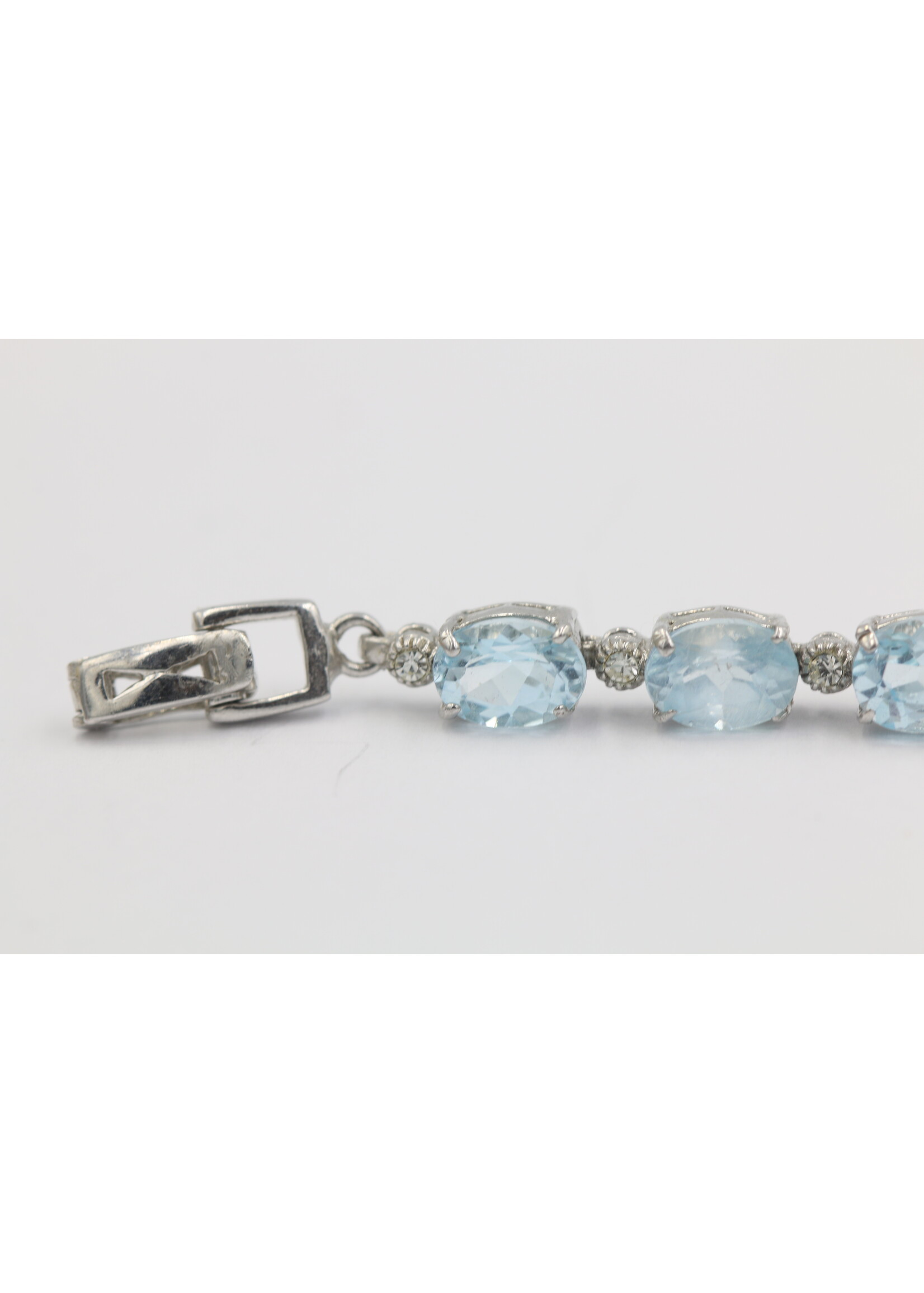 925 rhodium plated silver bracelet set with natural Blue Topaz
