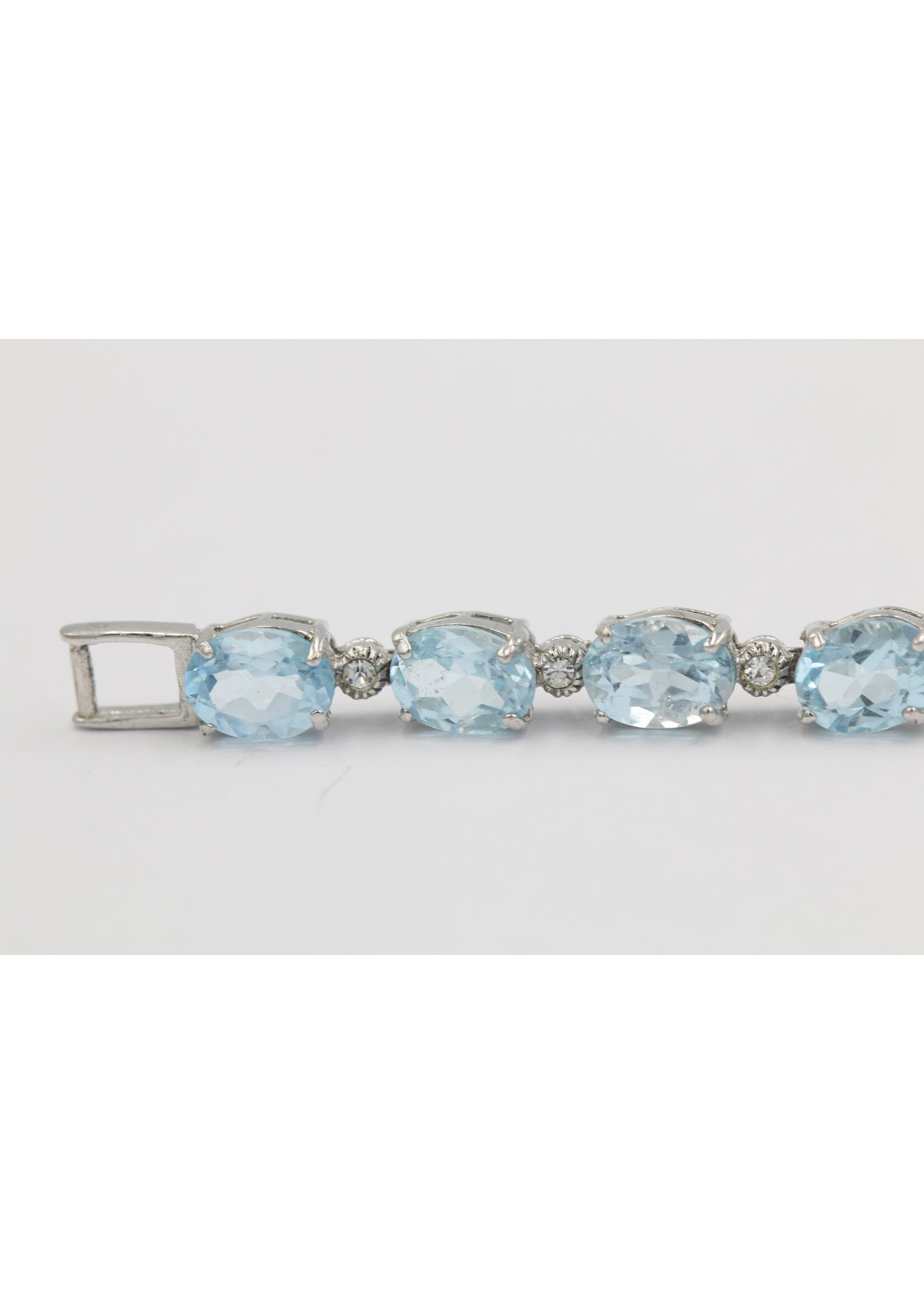 925 rhodium plated silver bracelet set with natural Blue Topaz