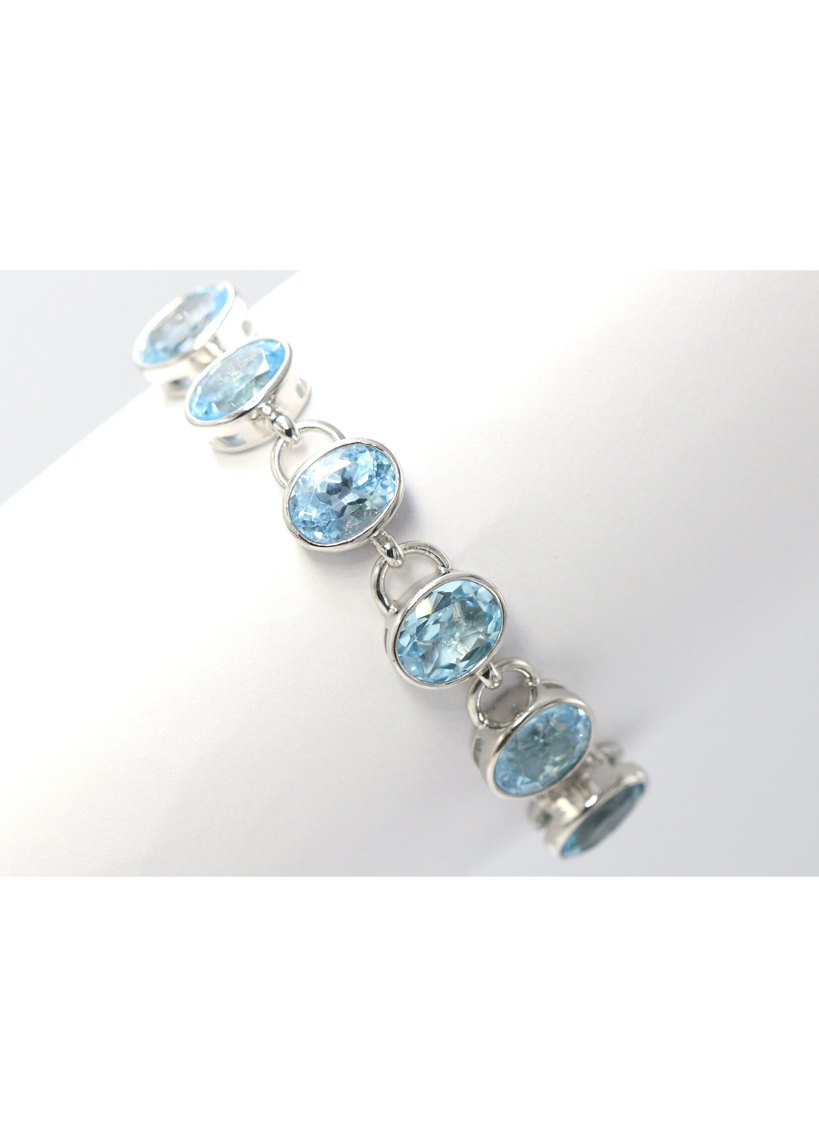 925 rhodium plated silver bracelet set with natural Blue Topaz