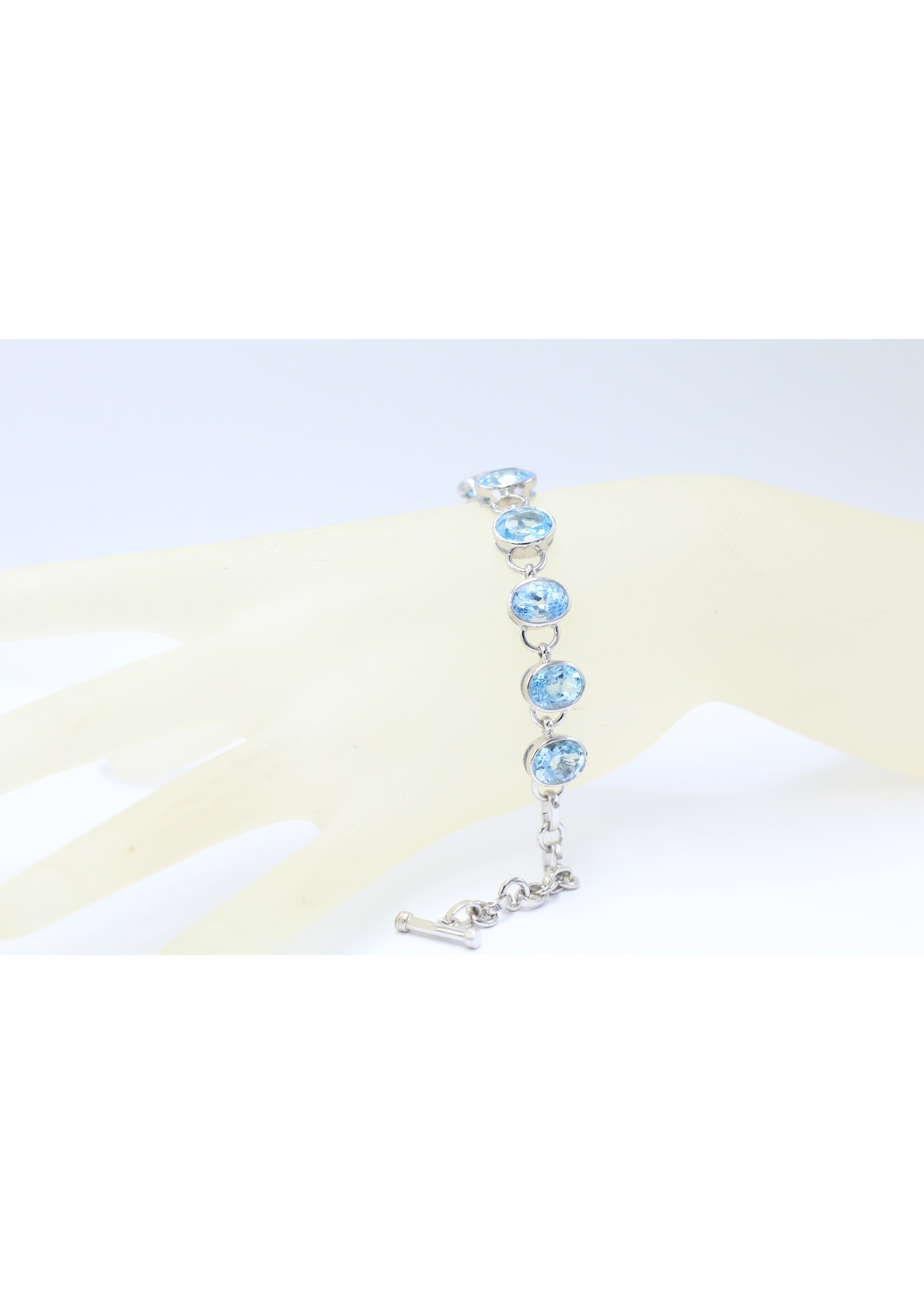 925 rhodium plated silver bracelet set with natural Blue Topaz