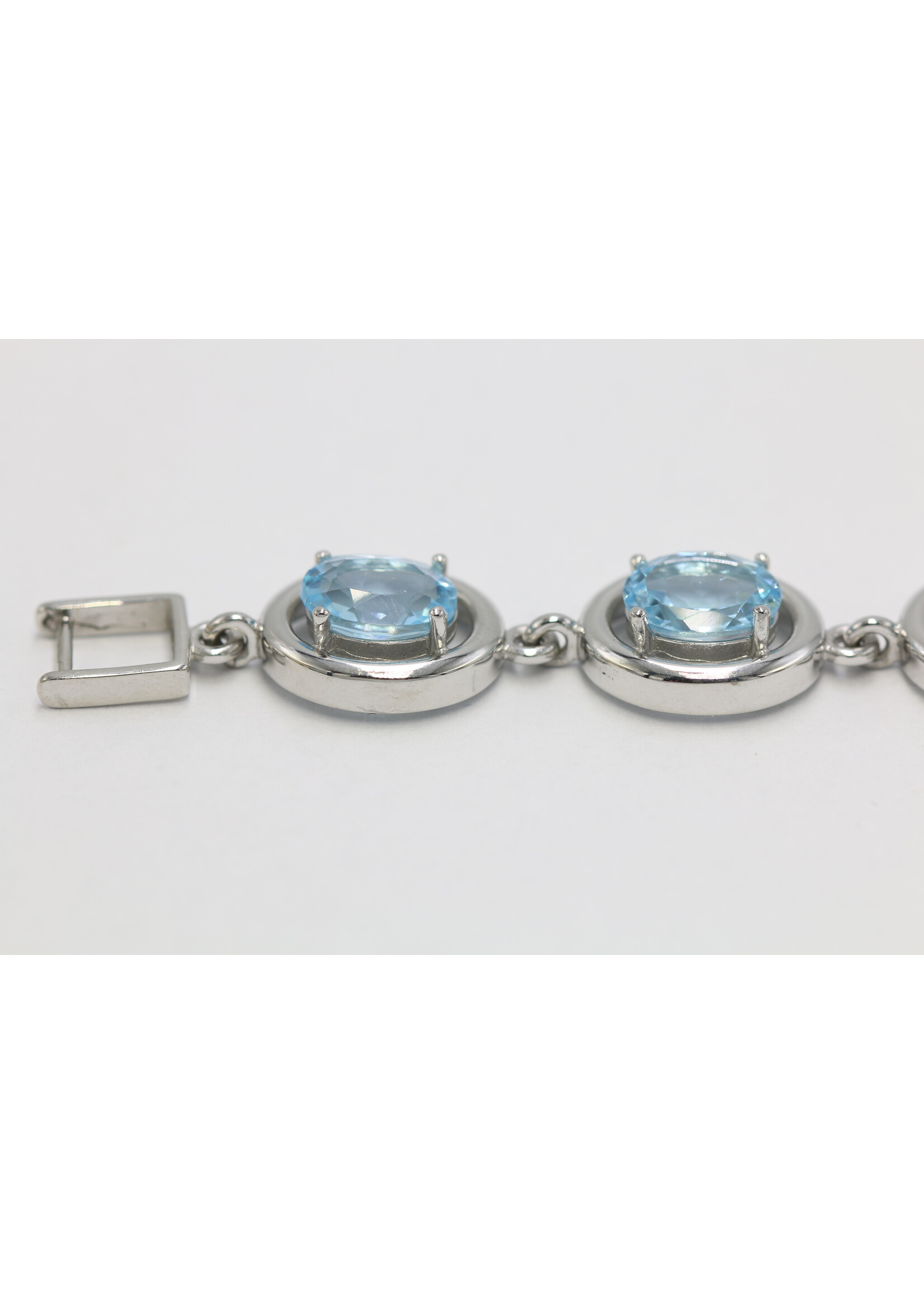 925 rhodium plated silver bracelet set with natural Blue Topaz