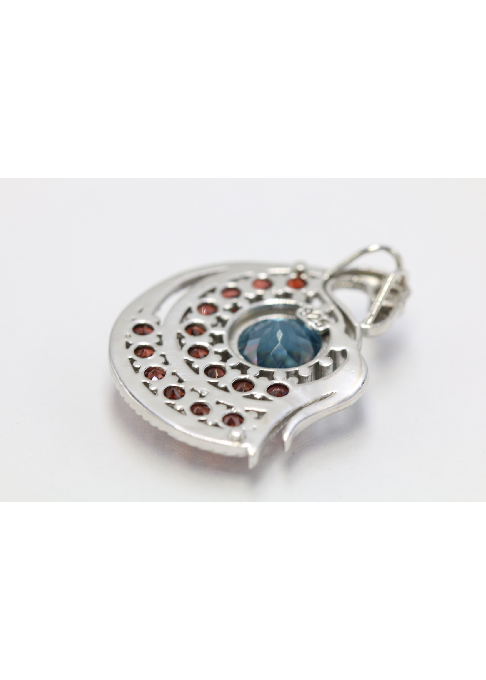 925 rhodium plated silver pendant set with natural topaz and garnets