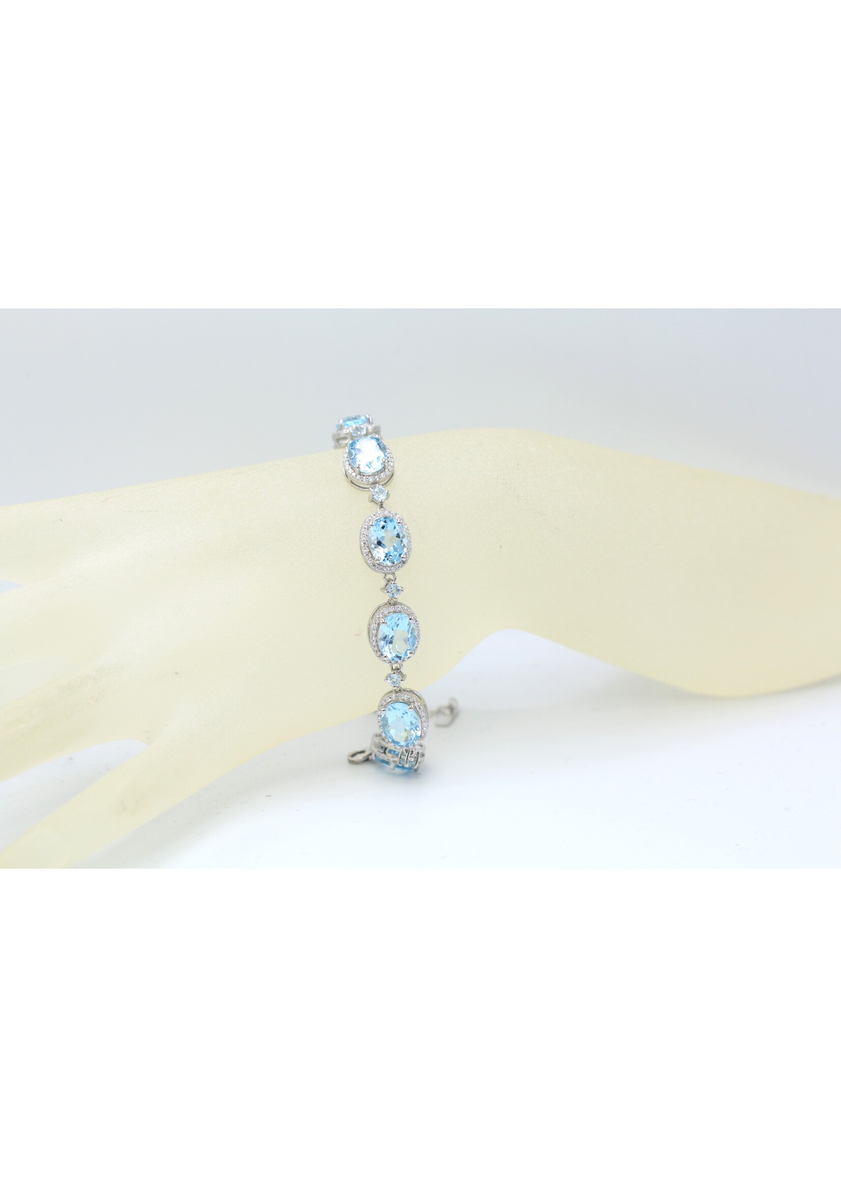 925 rhodium plated silver bracelet set with natural Blue Topaz