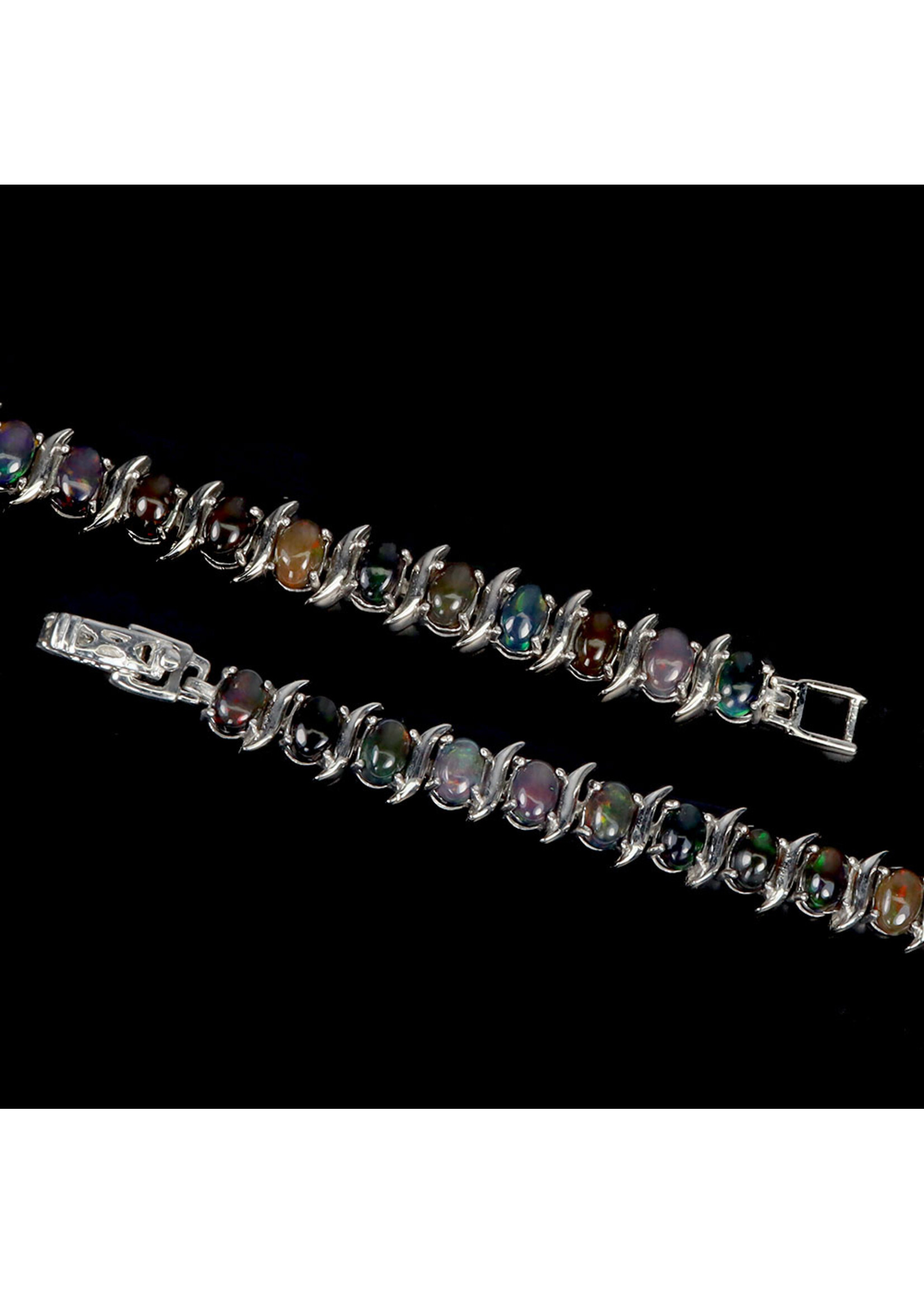 Montre en argent 925 rhodié sertie d'opale naturelle et de tanzanites