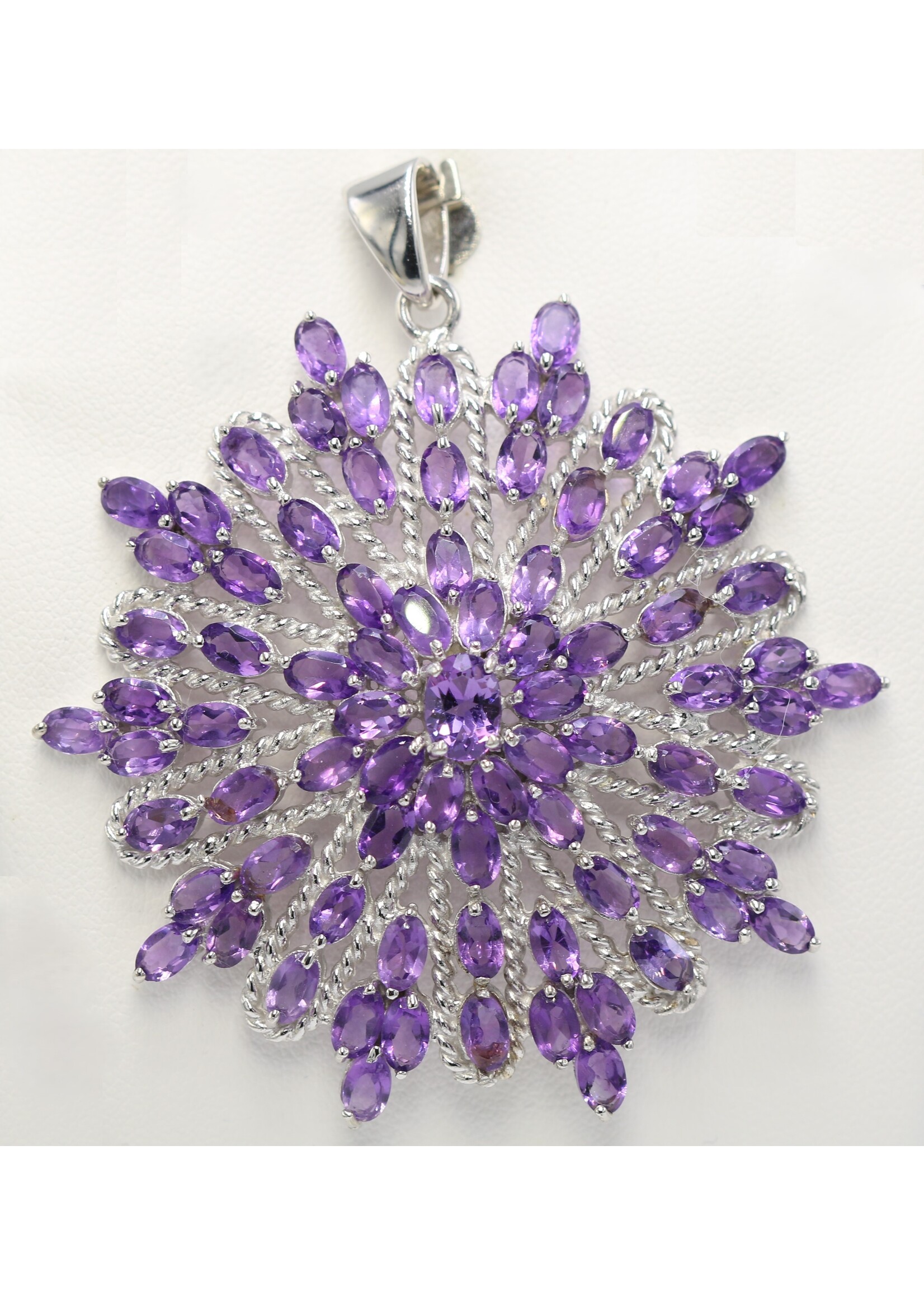 925 rhodium plated silver pendant set with natural amethysts