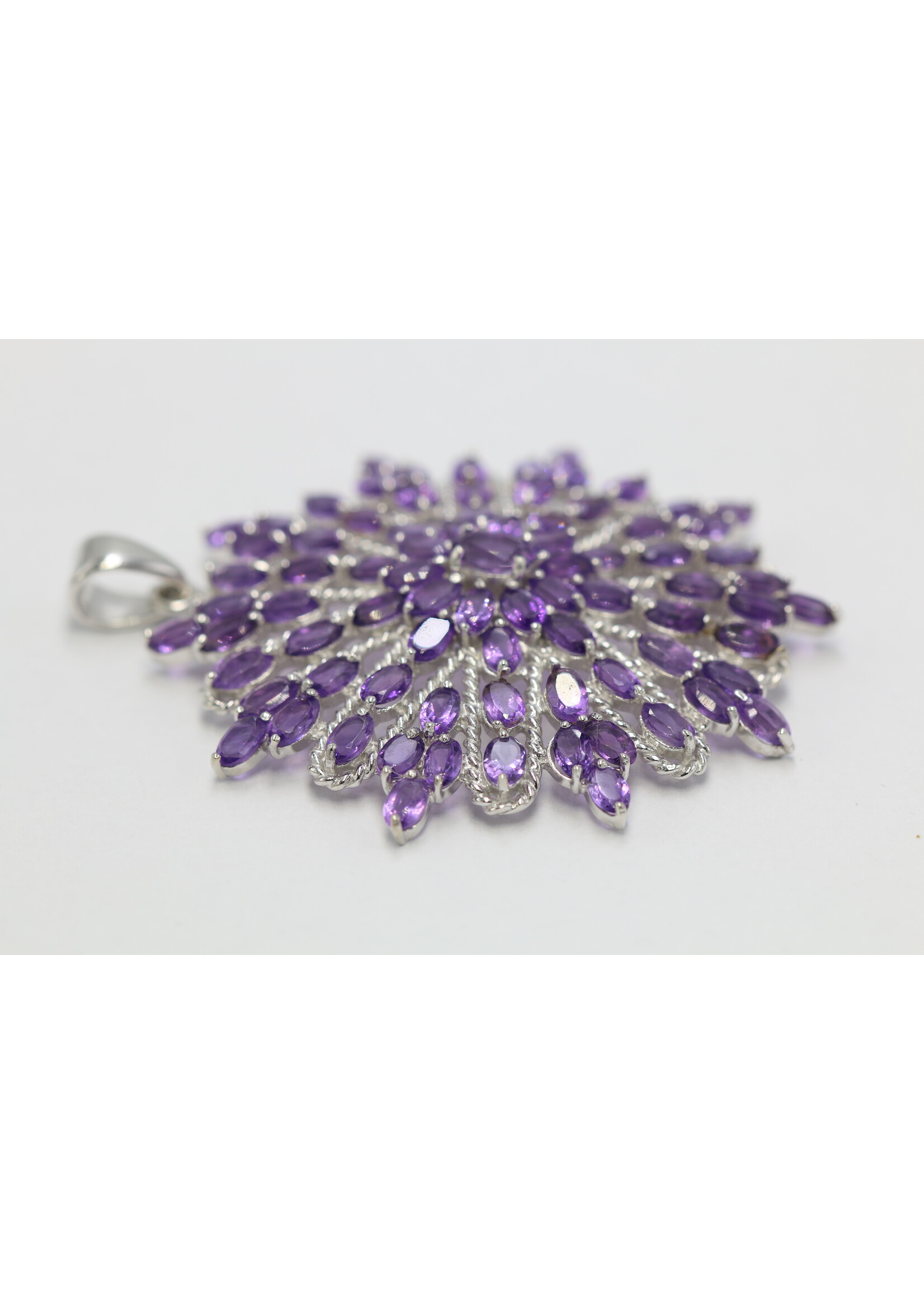 925 rhodium plated silver pendant set with natural amethysts