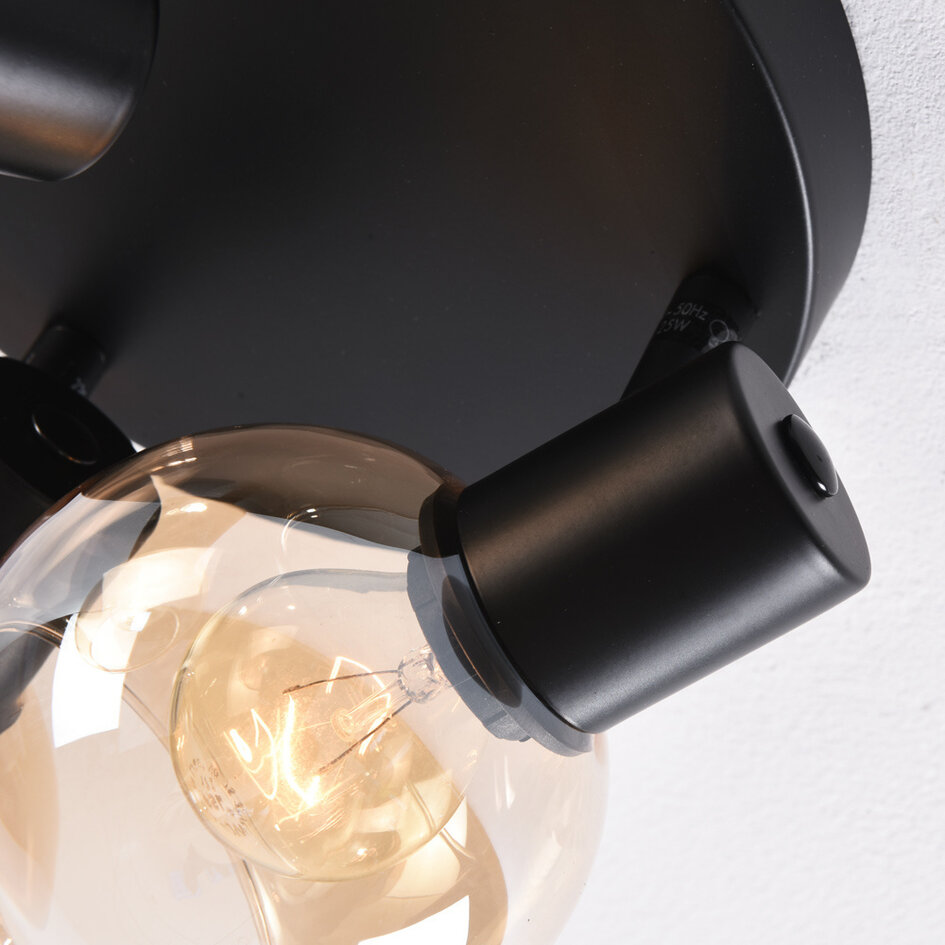 Plafonnier noir Peri avec 3 spots en verre ambré orientables