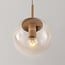 Suspension Alea à 5 lumières - beige et globes en verre transparent