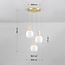 Suspension 3 lumières Vesso avec abat-jours en verre blanc laiteux et travertin