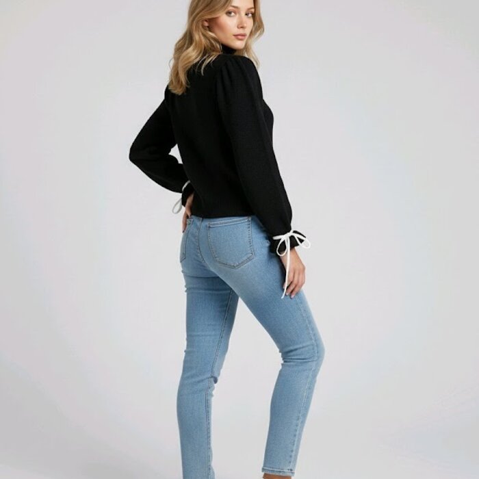 Norella – Zwarte Trui Met Witte Fluwelen Strikjes