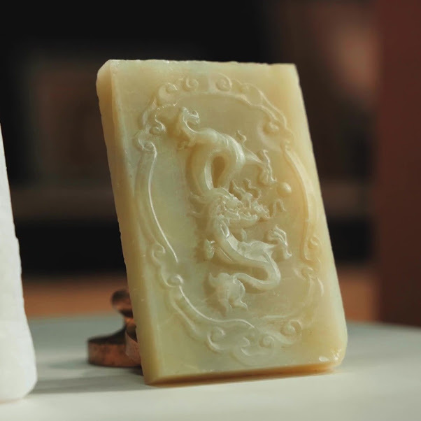 Piece of jade with a routed design of a chinese dragon