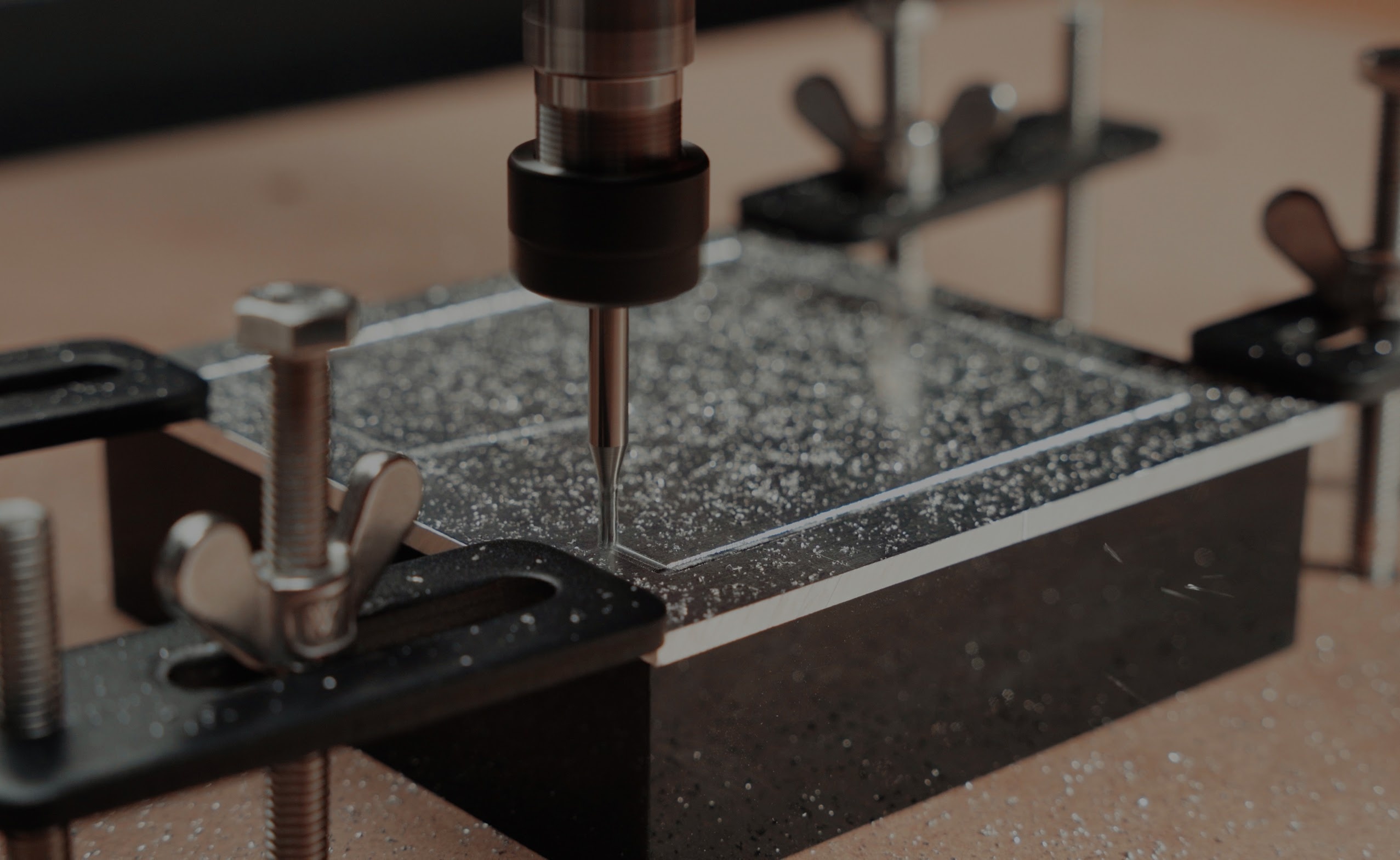 Close-up of a piece of metal being milled by the AtomStack C4 CNC router