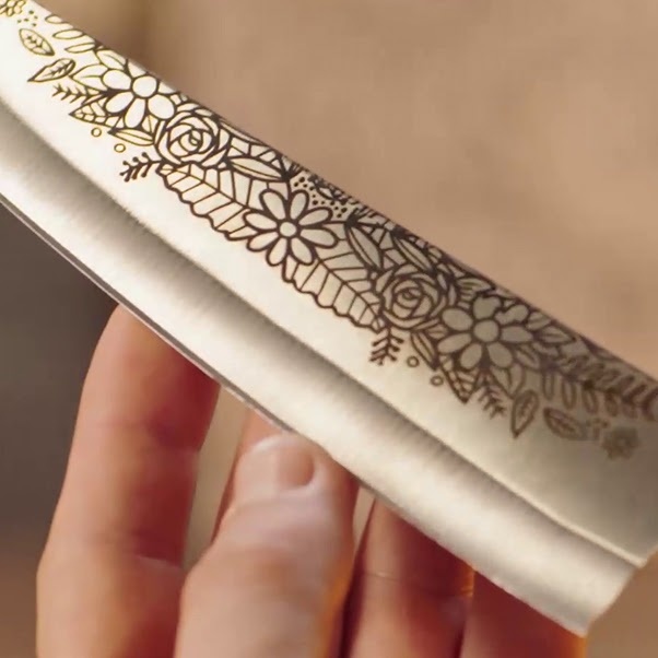 Engraved blade of a knife with a floral motif